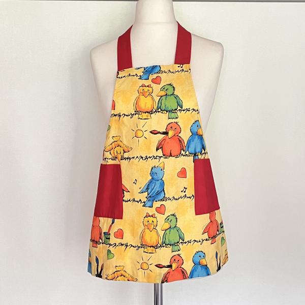 Kinderschürze für Mädchen mit lustigen Vögeln